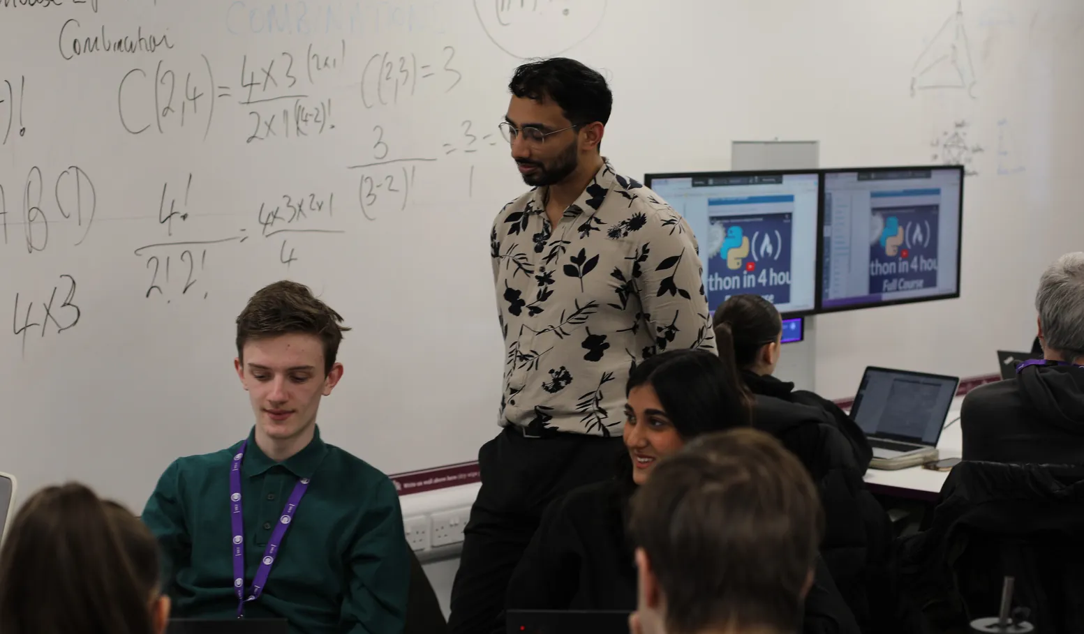 Iman Hussain at work with a colleague
